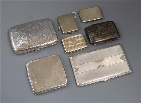 An engraved silver cigar case, three silver cigarette cases and three match cases, some engine-turned.
